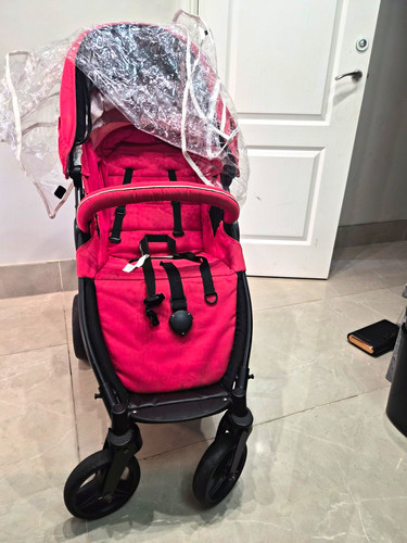 Red baby stroller with