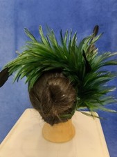 green feather comb fascinator