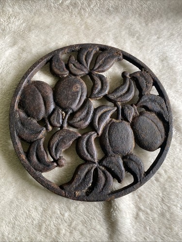 Vintage cast iron - trivet, plum