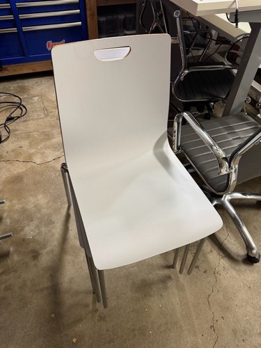 White molded stacking chair