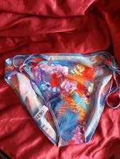 KINIKI tan through bikini