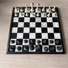 ANTIQUE CARVED BONE CHESS SET AND BOARD 