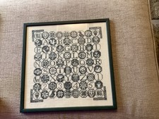 Blue quaker compketed cross stitch sampler