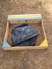 plum wooden sandpit with cover