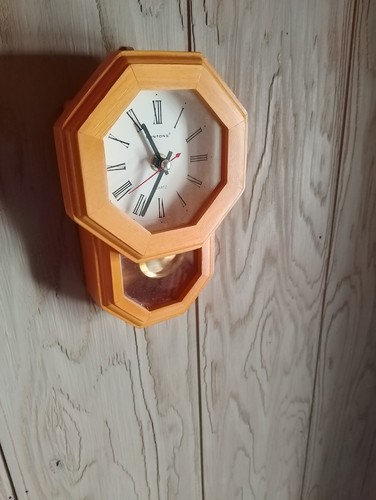 Used light wood clock with - light,