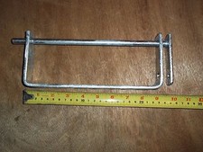 Oil tank lid lock shackle