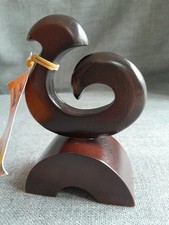 Hand-carved wooden Maori Koru