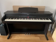 Roland HP-2e Electric Piano dark wood finish. 