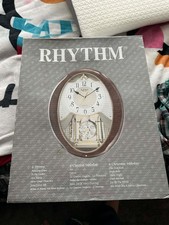 Small world Rhythm wall clock