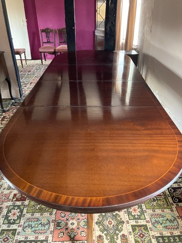 Polished mahogany oval dining