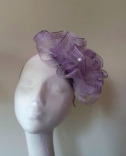 PRETTY LILAC FASCINATOR ON BAND