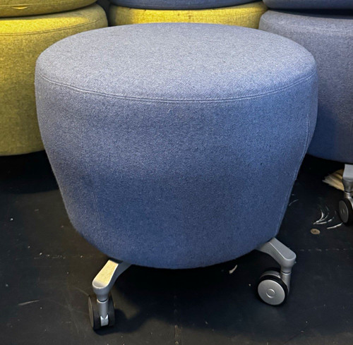 Round blue upholstered ottoman - round,