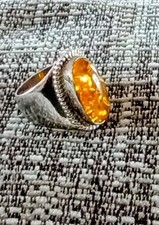 ladies amber ring with a generous amount of silver size p.