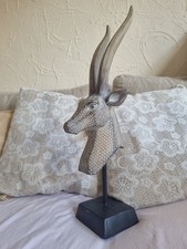 decorative antelope head sculpture on a stand