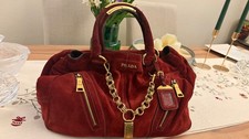 a Prada satchel, specifically