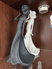 A Pair Of Royal Doulton Figurines of Ladies. In Black And White Porcelain