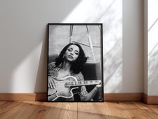 Sade Adu Playing Guitar