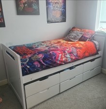 Bed with pull out for an additional mattress & 3 drawers (mattress not included)