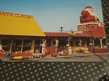VINTAGE  SANTA POSTCARD   WITH TOY PEDAL CARS AMERICAN
