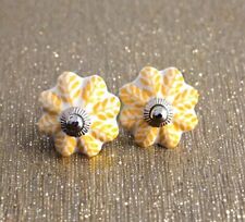 Yellow and white knobs Hand