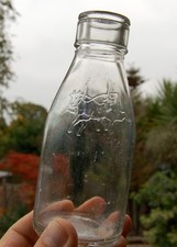lovely 1950's " Dancing Cow " ( Healds )l dairy milk bottle 1/2