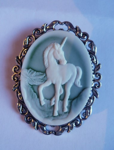 Green and white unicorn brooch - and,