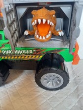 Motorized Dino Hauler Caged Dinosaur Toy with Lights and Sounds