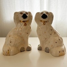 A pair of ceramic mantle dogs