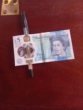 AA 59  801  5 pound note. Unc