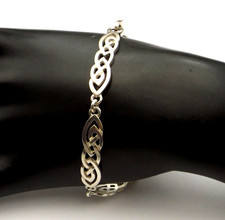 Sterling silver link bracelet pretty Celtic knot long oval design by Pat Cheney