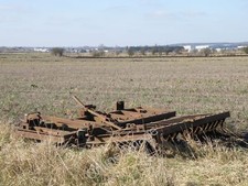 Photo 6x4 Disc harrows on the field edge Dyke/TF1022 An old set of Petit c2010