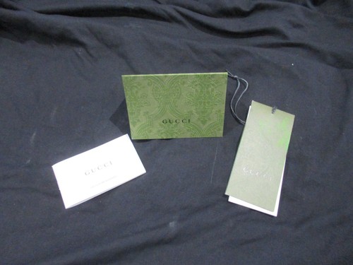 Gucci receipt card - receipt/card, and