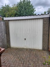 A Pre-fabricated Garage with garage door, UPVC door, and UPVC window
