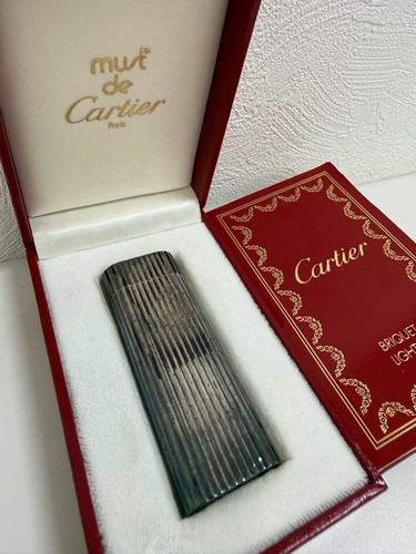 Must cartier lighter - de,