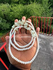 White crystals with butterfly accents and gold seed bead