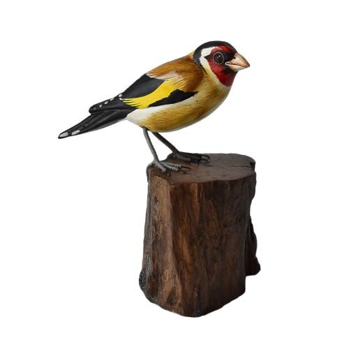 Goldfinch tree trunk hand - goldfinch,