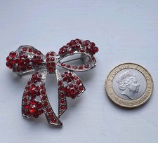 Silver Tone Red Bow