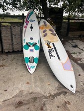 2 windsurfing boards, one hard rock, one Tiga. 