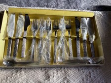 Vintage stainless steel 6 place setting dessert cutlery set made in Sheffield.