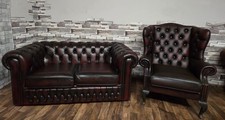 Chesterfield suite two seater sofa and a Queen Ann chair in antique ox blood red