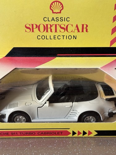 Two boxed porsche models - two,