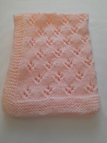 Hand knitted dolls pram cot - knitted,