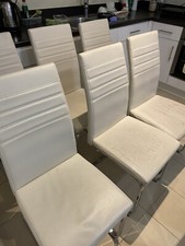 Dwell  Contemporary dining chairs Available , Metal  Frames, Need Recovering