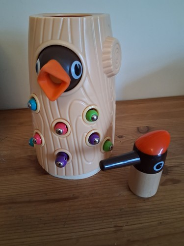 Top bright wooden - , woodpecker