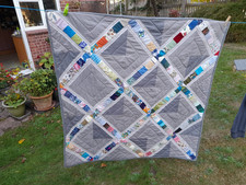 Grey and multicoloured sashing lap quilt, squares 'en point', machine quilted