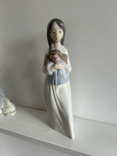 Nao lladro figurine - by,