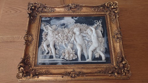 Large framed white cherub