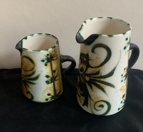 Pair newlyn milk jugs folk - jugs.,