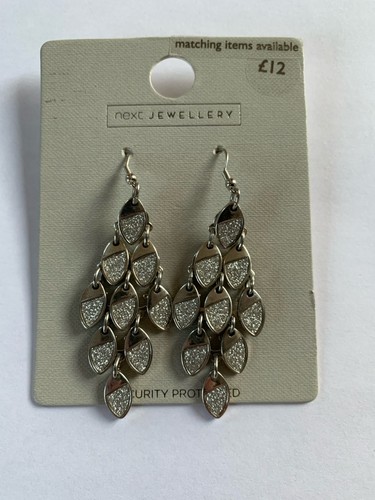Next silver tone - next,