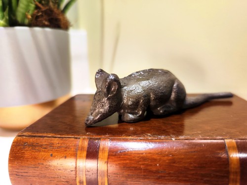Cast iron mouse lying - lying, down